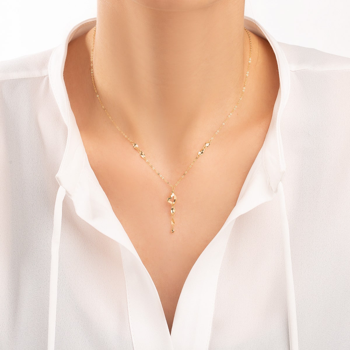 Gold sequin heart necklace